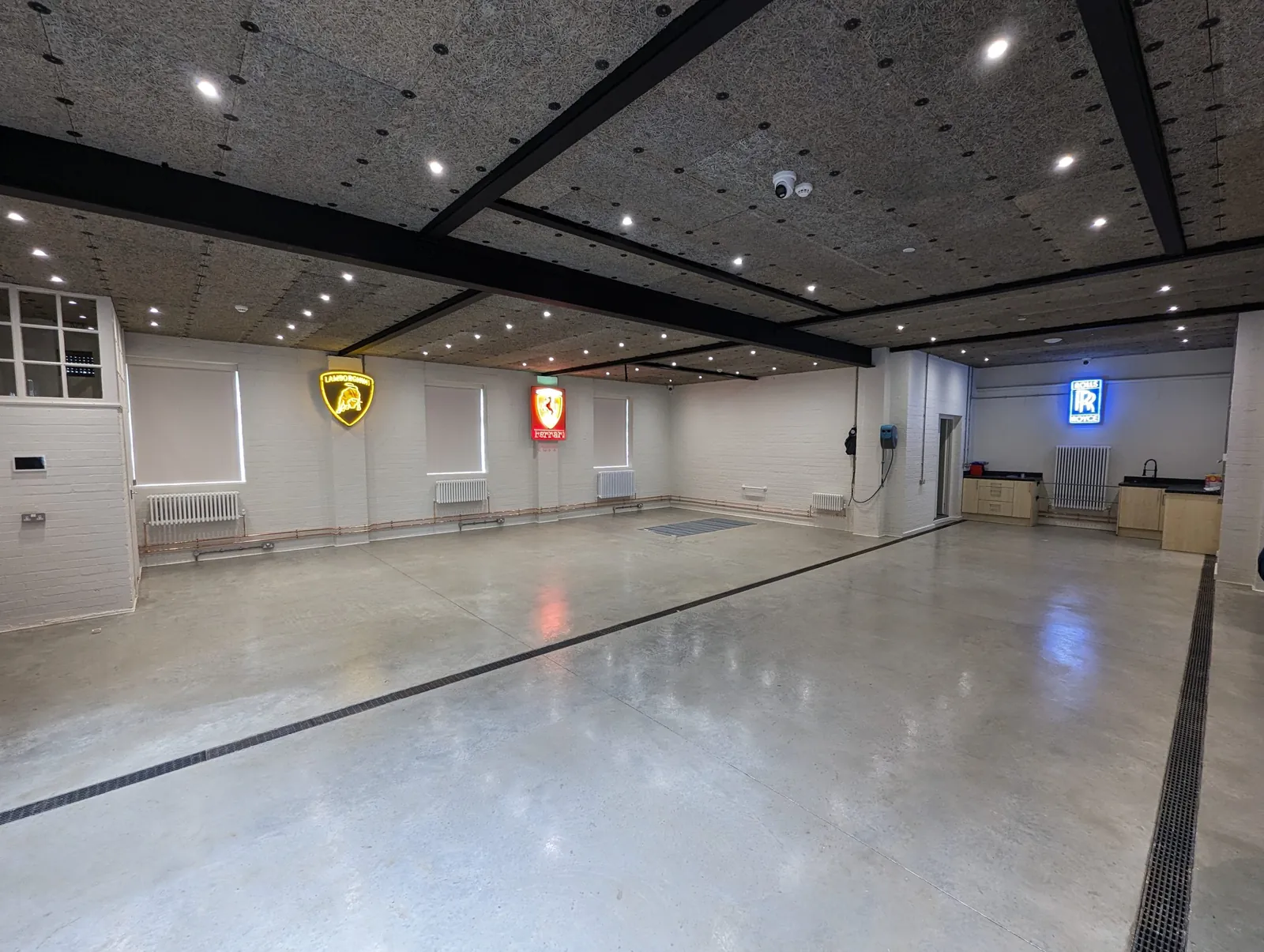 Commercial showroom fit-out with polished floor and suspended ceiling